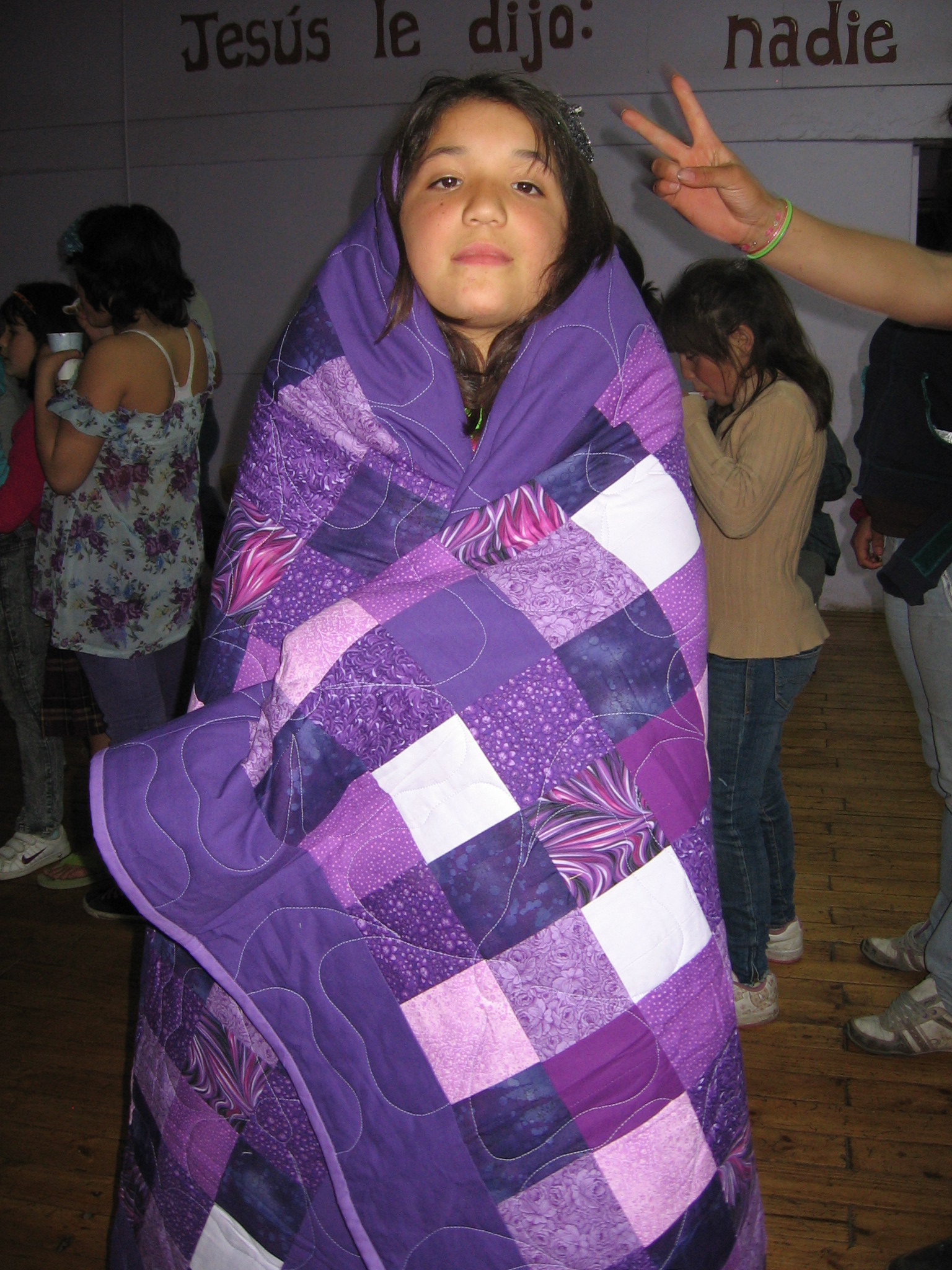 Girl with one of the Quilts given to all the Hogar Girls